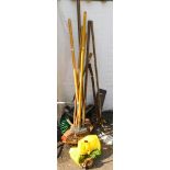 A selection of garden tools, to include hoes, racks, hose, oil can, etc. (a quantity)