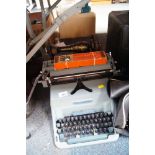 An Imperial 70 typewriter and a Singer sewing machine. (2)