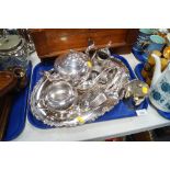 Silver plate, to include tray, loose flatware, three piece tea service, napkin rings, etc. (1 tray)