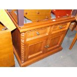 A pine side cabinet, with a granite top.