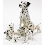 A group of Dalmatian ornaments, to include a large Beswick seated Dalmatian, 36cm high, a Beswick Ar