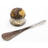 Two items of silver ware, to include a Edward VII silver collared pin cushion, with cherub and flora