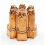 A Victorian copper six point jelly mould, with six turrets with floral design top, and number to rim