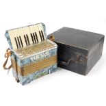 A Hess cased accordion.