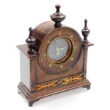 A Timecal mahogany cased mantel clock, the circular clock head with brass button dial and parquetry