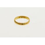 A 22ct gold thick wedding band, ring size R, 5g.