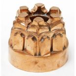 A Victorian copper jelly mould, in a castle turret form of six points, numbered 284, 12cm high, 14cm