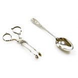 A pair of George V silver sugar scissors, with fluted handles and shell shaped clasps, maker JB and