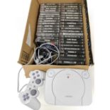 A Sony PS1 and various games and controller.