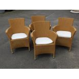 A set of four Bramble Crest garden furniture rush seated chairs, each with a brown plastic finish on