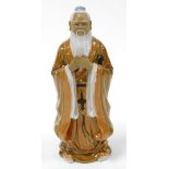 A 20thC Chinese figure of a standing bearded sage, in flowing robes, impressed marks beneath, 34cm h
