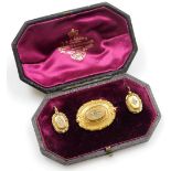 A Victorian bloomed gold and seed pearl set brooch and earring set, in T&J Adams and Sons of London