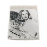 Honor Blackman. A signed black and white photograph of the actress in the stables at Goldfinger's ra