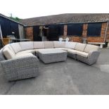 An extensive Four Seasons outdoor rattan garden suite, comprising two end single seats, four single