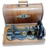 A cased Singer sewing machine.