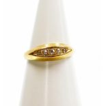 An 18ct gold diamond set gypsy ring, set with five tiny diamonds, ring size M, 1.8g all in.