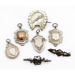 A small group of silver and other jewellery, to include four silver fobs, a steel mispah brooch, and