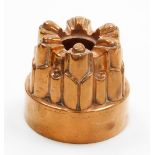 A Victorian Benham and Froud copper jelly mould, with six fluted point design, numbered 458 with cro