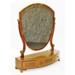 A George III mahogany dressing table mirror, the shield mirror on swig frame with marquetry banding