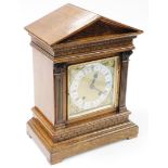 A Winterhalder & Hofmeier late 19thC oak cased mantel clock, with triangular set top, carved decorat