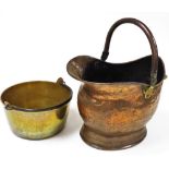 A copper coal helmet and a brass skillet pan. (2)