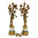 A pair of 19thC French ormolu candelabra, each with four branch candle holders and foliate ornamenta