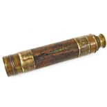 An early 20thC brass three drawer telescope, with leather centre section, when closed 21cm wide. (AF