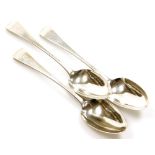 Three George IV silver Old English pattern serving spoons by William Bateman, with a lion rampant cr