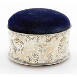 An Edward VII circular silver trinket box, the silver collar with cherub and cross flower detailing,