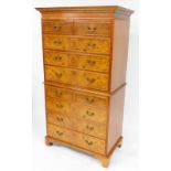 A mahogany and burr walnut chest on chest, the top configured of two short and three long drawers, w