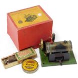 A small steam engine, with accessories, boxed.