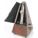A cased metronome, by Maelzel, 23cm high.