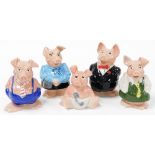 A group of Wade NatWest piggy banks, baby, two females and two males. (5)