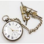 A silver cased pocket watch, with white enamel dial and seconds dial with gold handles, on a silver