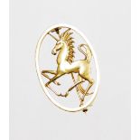 A 9ct gold unicorn brooch, the oval plaque with central pierced figure of a unicorn, open single pin