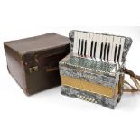 An Alvari cased accordion.