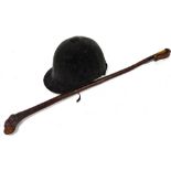 A horse riding hat and whip.