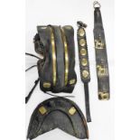 A group of vintage leather and brass horse harnesses, to include a seat with LMS stamp, a horse bras