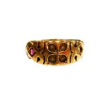 An Edwardian dress ring, set with seed pearls and garnet (1 stone missing) yellow metal stamped 15c,