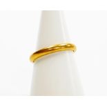 A 22ct gold wedding band, ring size P½, 4.3g.