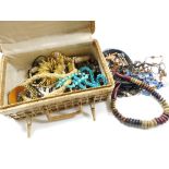 A wicker box, containing a quantity of various costume jewellery, Eastern and other style tribal sty