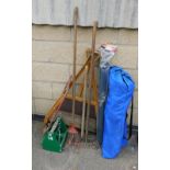 A group of gardening equipment, to include rakes, drain cleaning bit, two camping chairs, carry stan