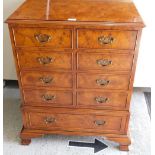 A walnut veneered television cabinet.