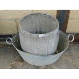 Two galvanized tubs, comprising a galvanized dolly tub and a galvanized bath.