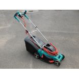 A Bosch electric lawnmower.