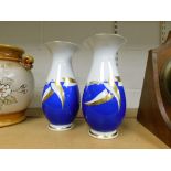 A pair of Roloff German hand painted vases, with blue and gold detailing, 26cm high.