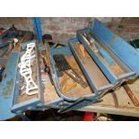 A metal cantilever toolbox and contents, to include pliers, bolts, nuts, etc.