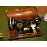 A cased Singer sewing machine.