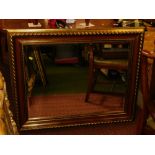 A gilt framed rectangular wall mirror, with a reeded overall border and painted red/orange inner sea