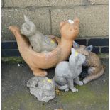 A group of garden ornaments, mainly cats, to include planter, three cat ornaments and a fox ornament